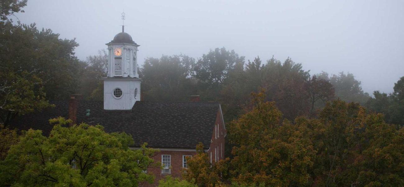 Image of the top of Cutler Hall on a foggy morning